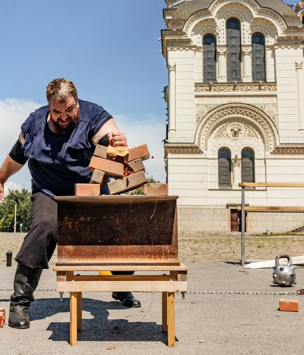 A person demonstrates balance and strength in a minimalist setting.